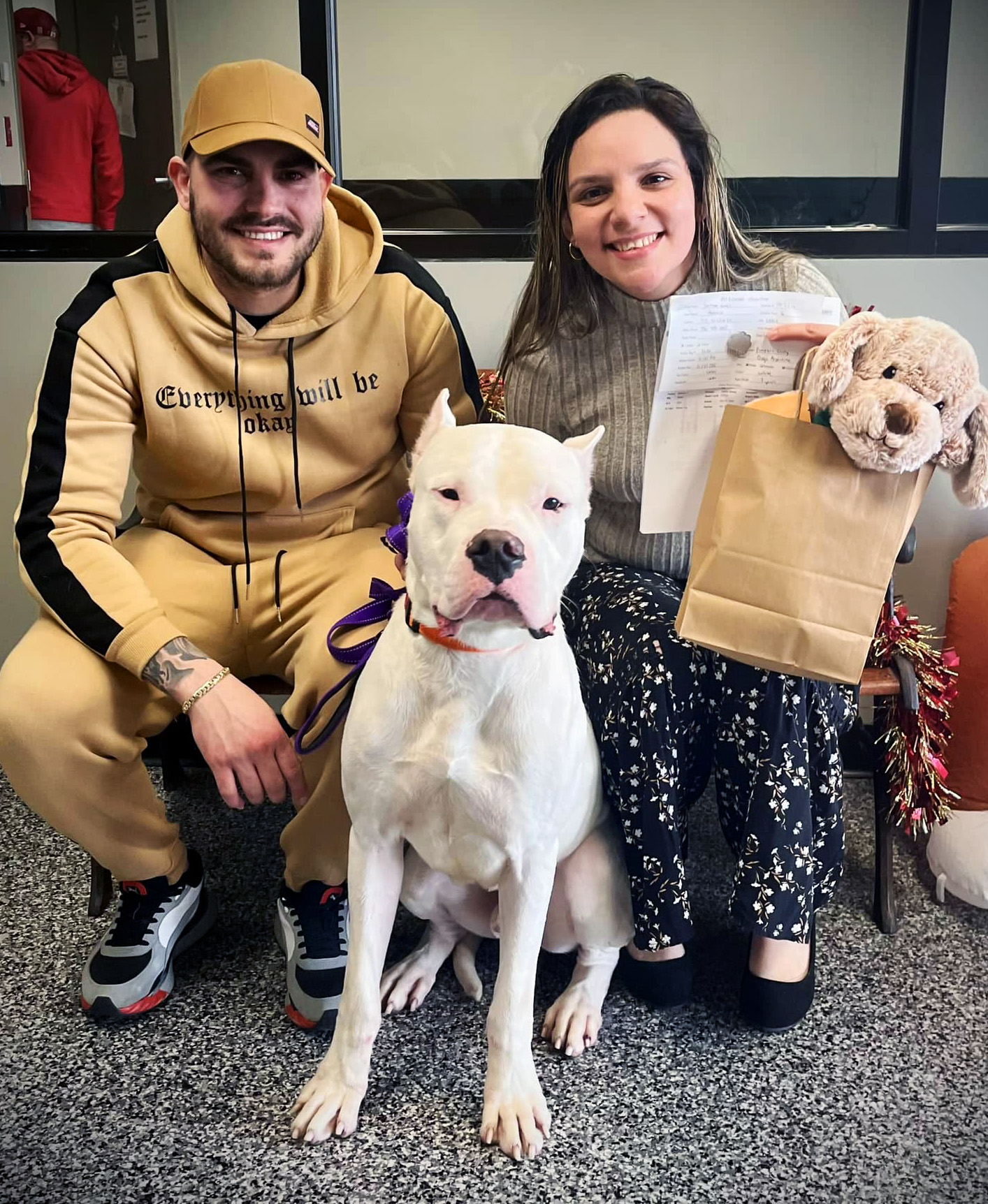 a dog getting adopted by a couple